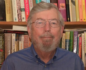 picture of person in front of book shelf