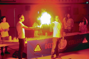 two chemists with a fireball between them 