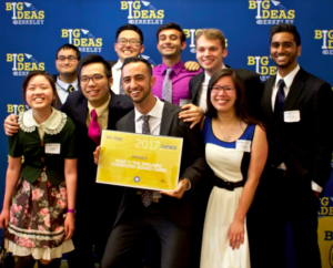 Group of people holding check