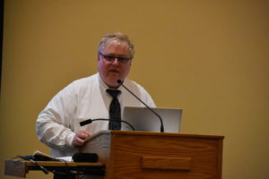 person standing at podium
