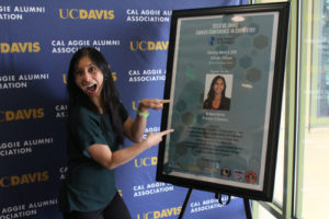 woman pointing at poster
