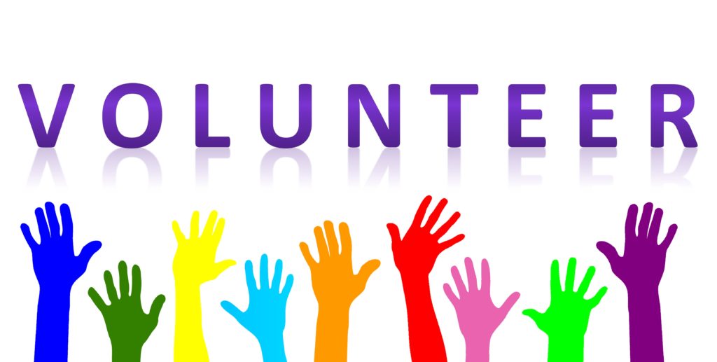 Volunteer with picture of hands underneath